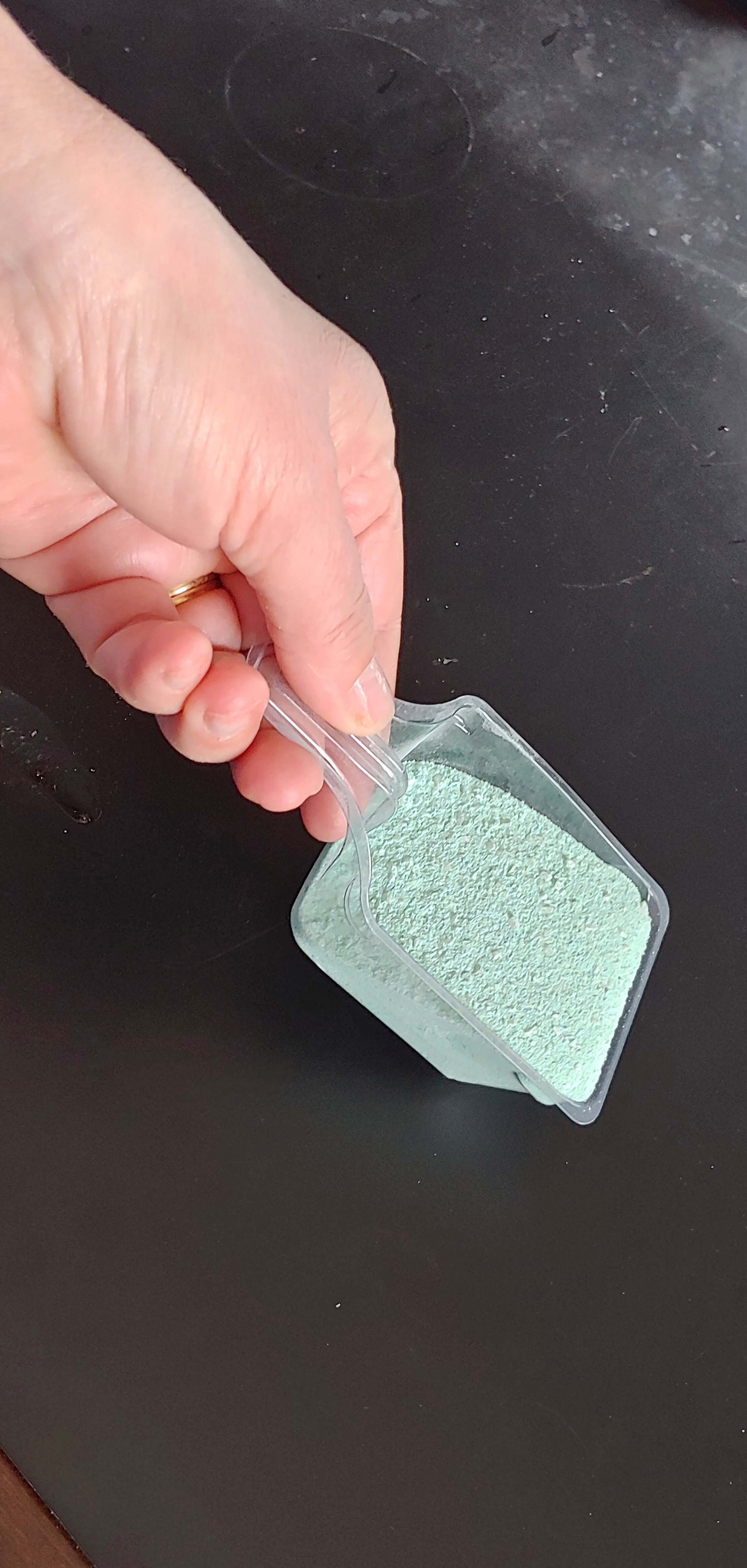 A scoop of CLEAN + CLEAR MINERALS ( 3 KG ) - Granular Pool and Spa Algaecide